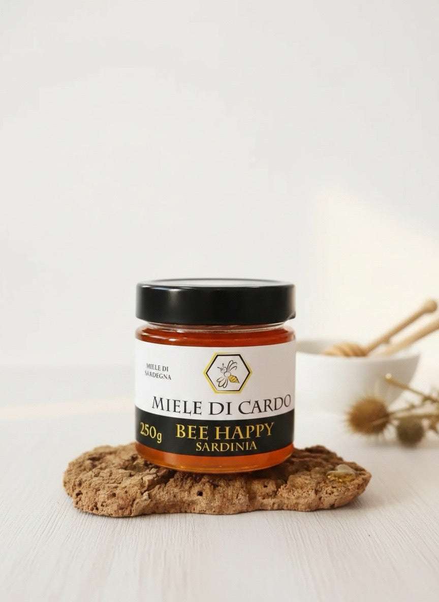 Barattolo di miele di cardo liquido ambrato chiaro dalla Sardegna, unico e naturale