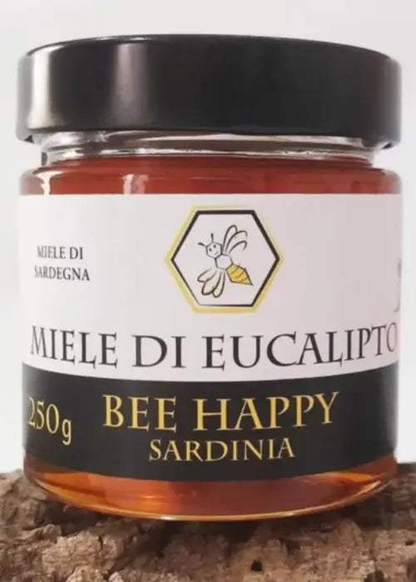 Barattolo di miele di eucalipto ambrato con consistenza cremosa e cristallizzazione fine