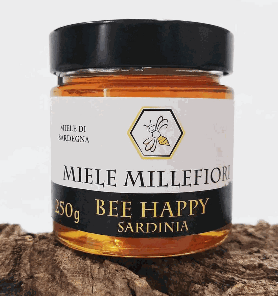 Miele di Millefiori in vasetto di vetro con miele ambrato, tappo nero ed etichetta bianca e nera da 250 g