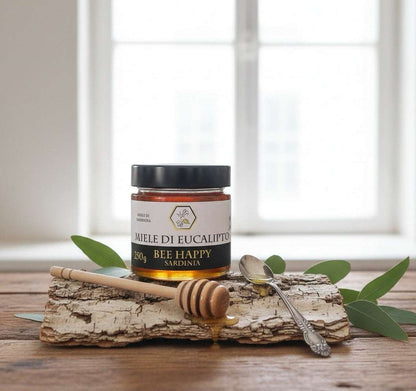 Barattolo di miele di eucalipto ambrato con consistenza cremosa e cristallizzazione fine